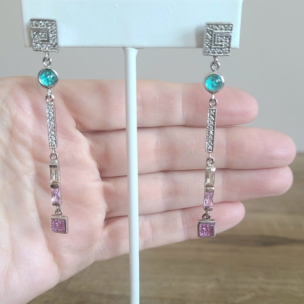 Long dangling sterling silver earrings with pink and green rhinestones.